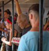 A man carrying home a cake on a bus in Cuba